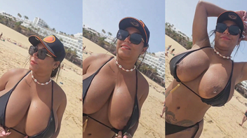 Mulata cavala na praia mostrando seus peitos enormes